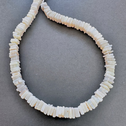 Natural gemstone beads in Moonstone, arranged on a 20cm strand with consistent cut.