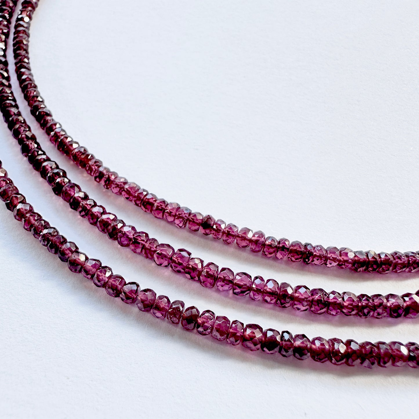 Handmade jewellery components Australia featuring garnet beads in 2.6mm to 3.6mm size range.