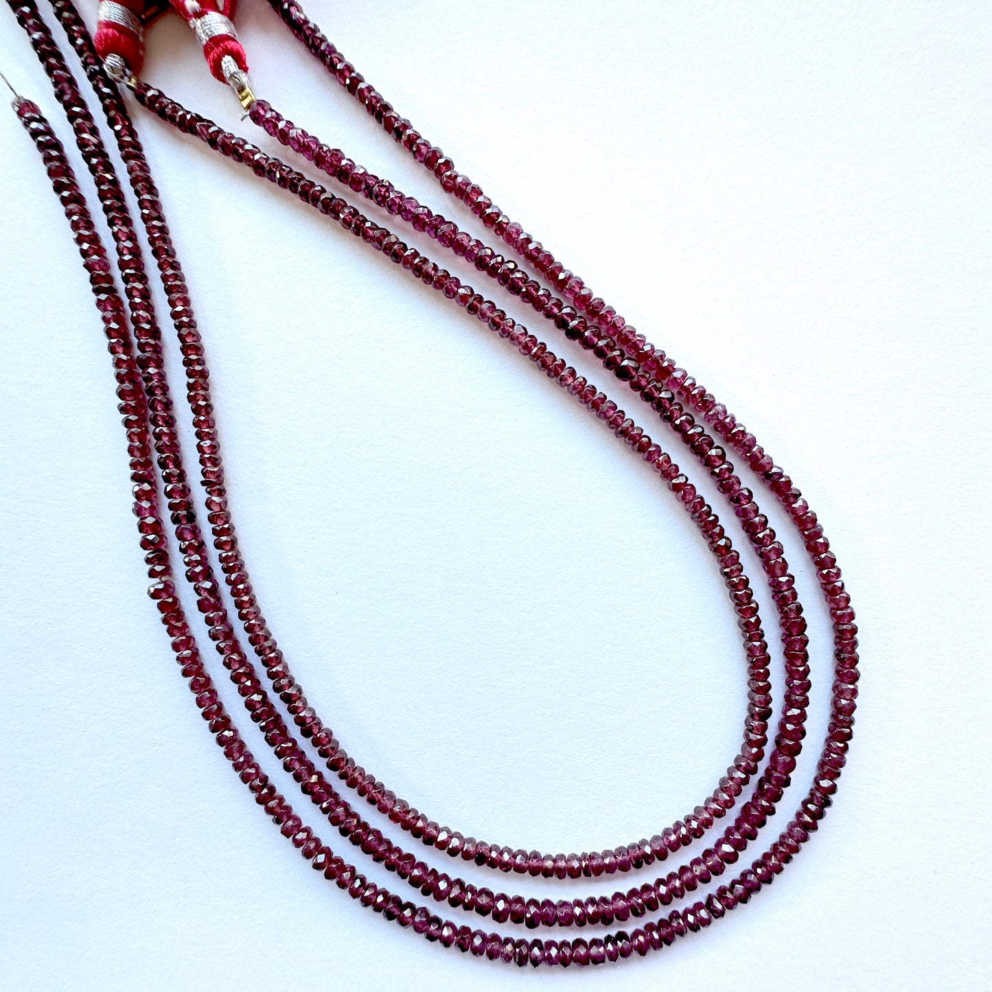 Australian gemstone bead supplier showcasing Mozambique Garnet beads with 0.4mm drill holes.