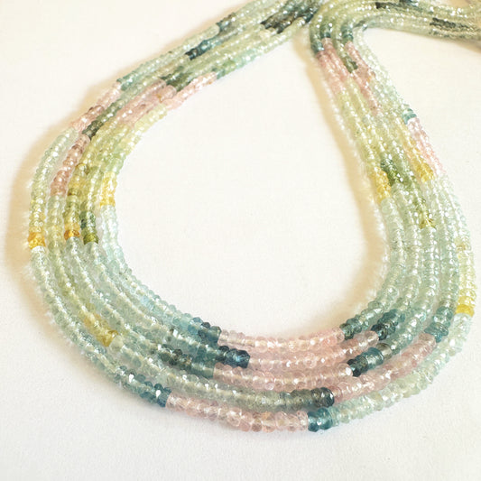 Close-up of Multi Aquamarine gemstones revealing clarity, soft blues, and fine craftsmanship.