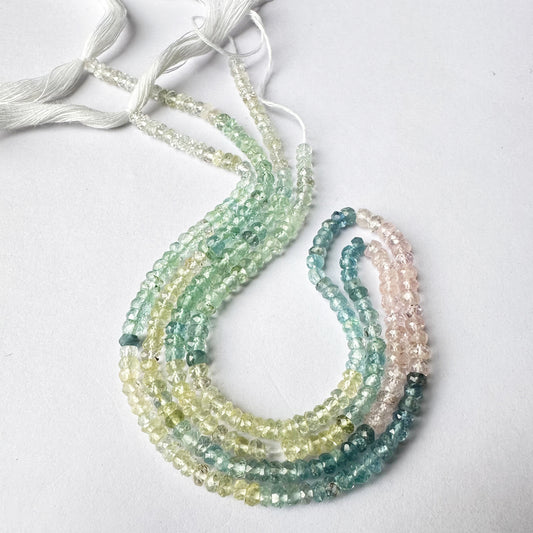 Vibrant mix of sky and sea-toned aquamarine beads in faceted rondelle cut.