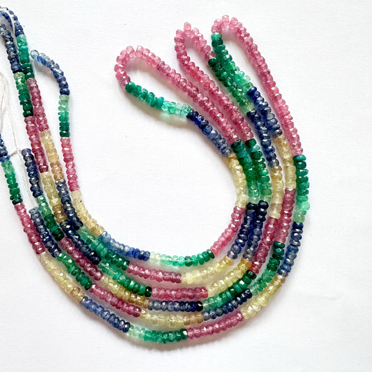 Emerald rondelle beads glowing with vivid green tones and precision cut finish.