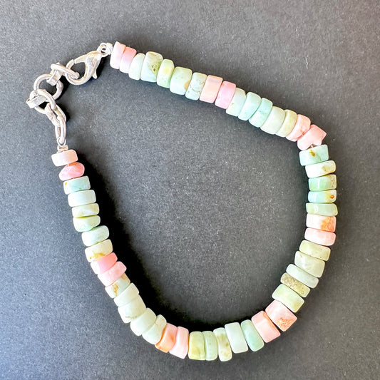 Close-up of multi stone bracelet featuring polished smooth wheel beads, vibrant colours and elegant shine.