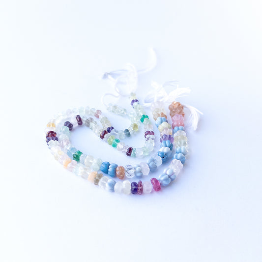 Genuine multi‑stone pumpkin cut gemstone beads showing pastel, golden and purple tones for handmade jewellery.
