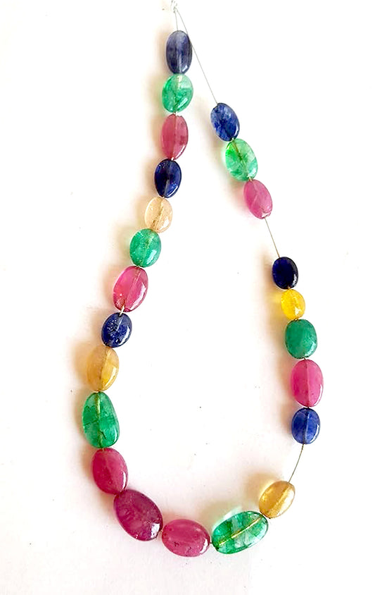 Ruby, emeralds and sapphire oval beads display rich colour contrast and consistent polish across the 23-piece strand.