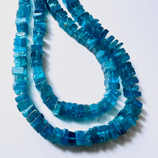 Natural gemstone beads for DIY jewellery featuring 5-6mm Neon Apatite squares with polished shine and geometric shape.