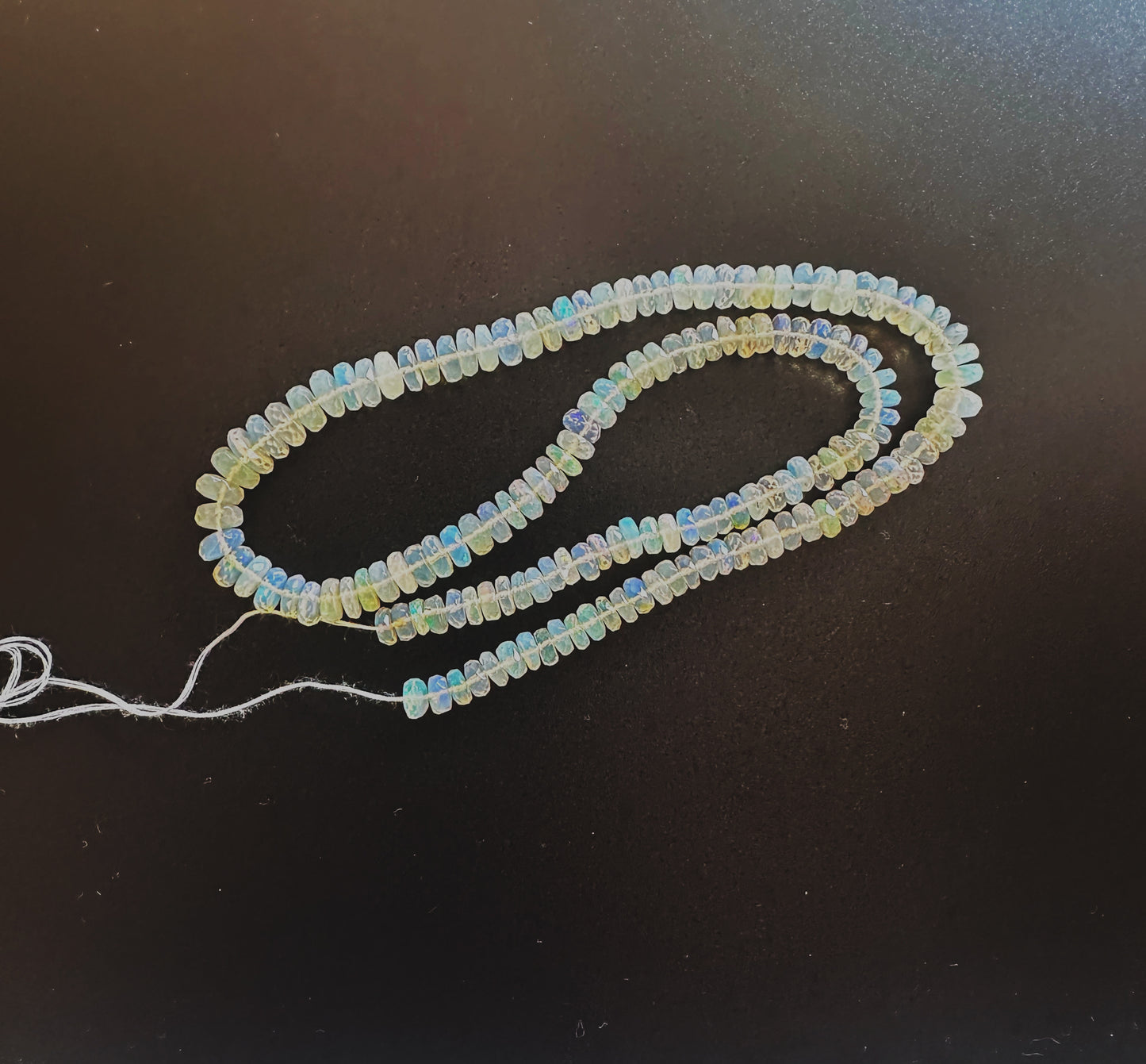 High-quality Opal rondelles with 0.5mm bead holes and radiant colour variation.
