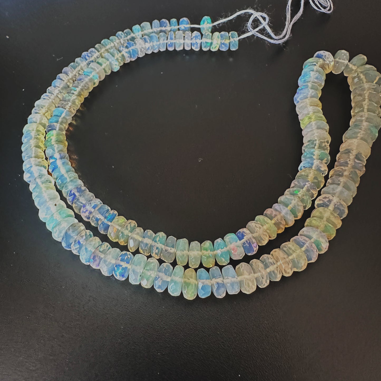 Natural Opal gemstone beads with faceted rondelle cut and luxurious finish.