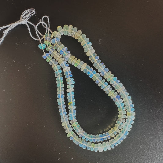 Opal beads arranged in a 40cm strand with shimmering facets and consistent sizing.