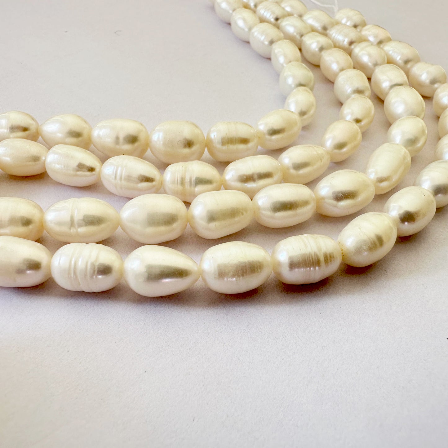 Natural oval pearls with varied size and natural finish for handmade jewellery.