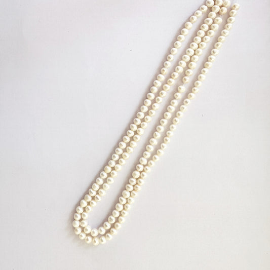 Smooth round pearls strung neatly across a 39cm strand for luxury beading.