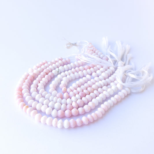 Genuine stone beads in soft blush tones, featuring faceted rondelles for DIY jewellery making.