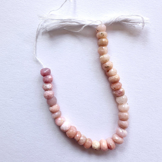 Stone beads featuring Pink Opal rondelles with high clarity and polished finish for jewellery making.