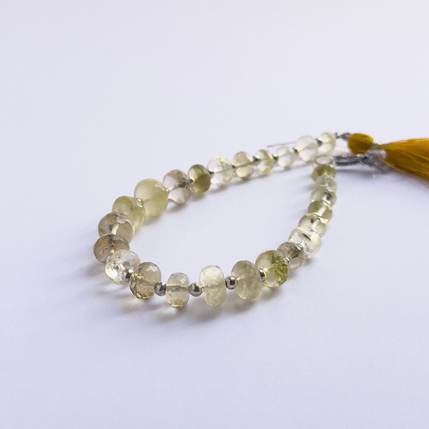 Natural gemstone beads for DIY jewellery, Prehnite rondelles with subtle sparkle and clarity.