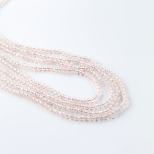 Rose Quartz faceted rondelle beads in a long strand, displaying soft colour and refined craftsmanship