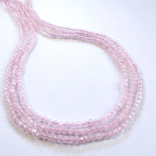 Natural gemstone beads in Rose Quartz, arranged on a 32cm strand for DIY jewellery.