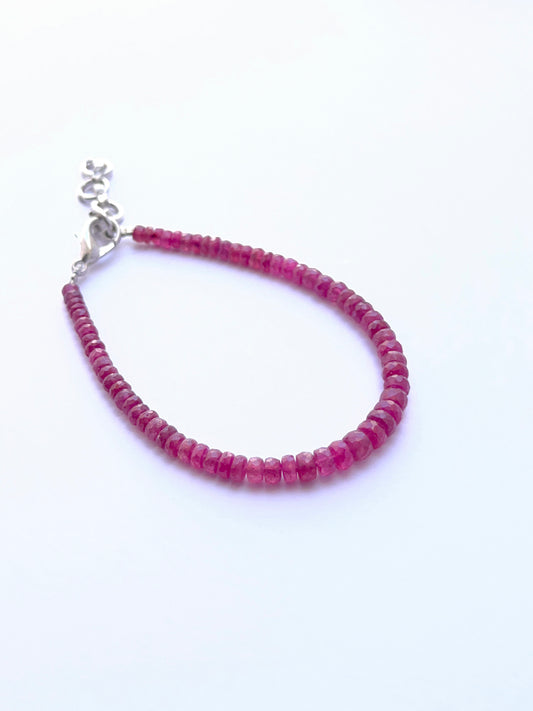 Elegant ruby bracelet featuring faceted beads in a refined layout.