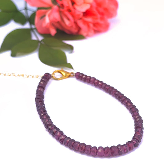 Close-up of Ruby gemstone bracelet showing sparkle and polished finish.