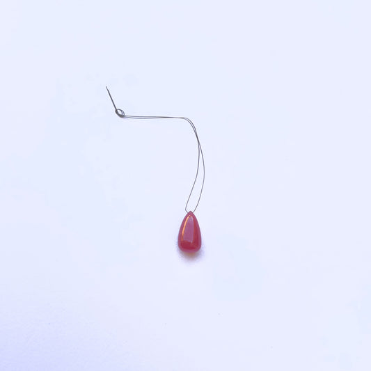 Ruby teardrop bead with smooth finish and rich red colour for DIY jewellery.