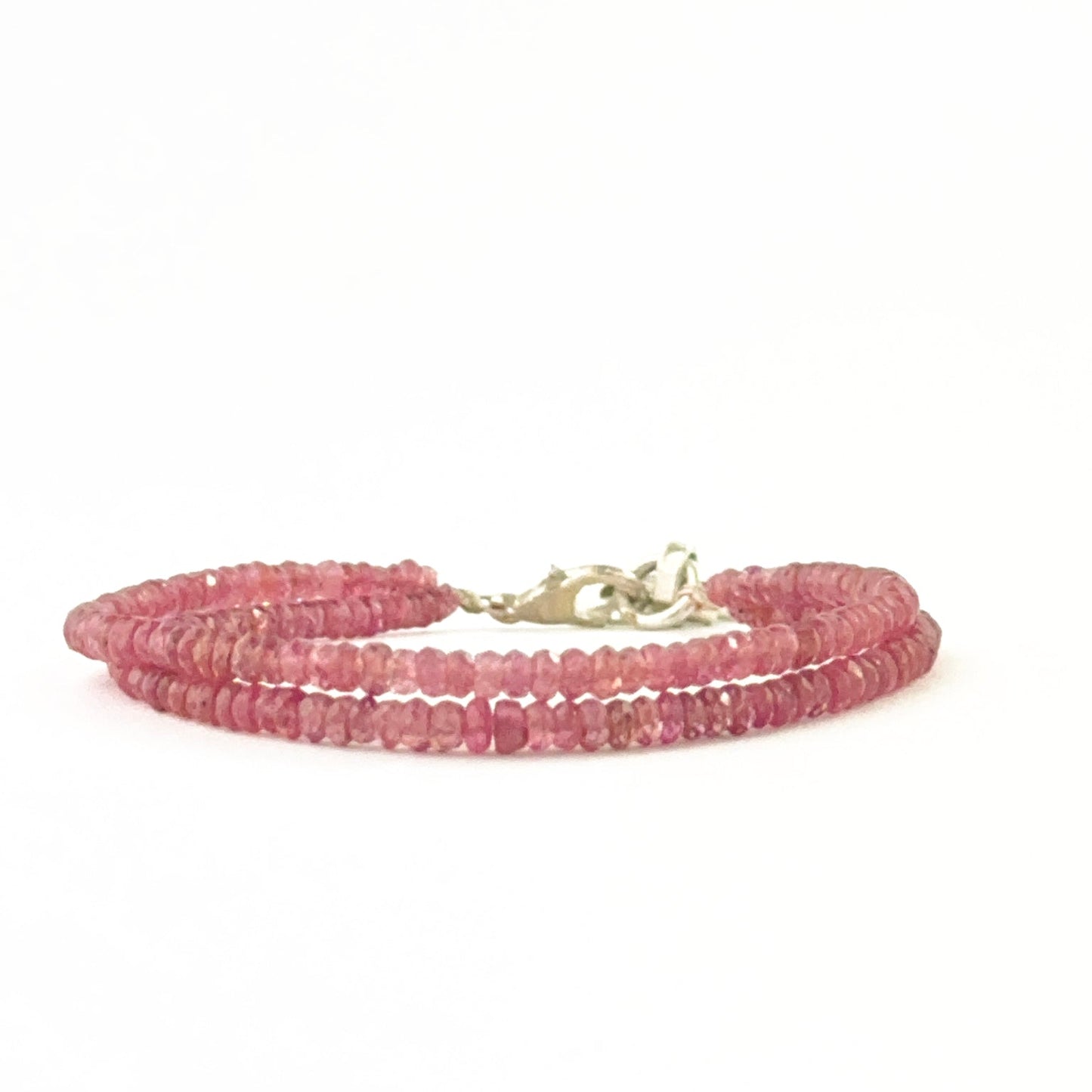 Multi‑strand ruby bead bracelet arranged with faceted rondelle beads and adjustable fit.