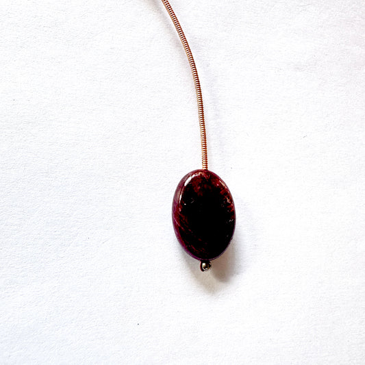 High-quality Ruby bead with smooth oval cut and consistent shape.
