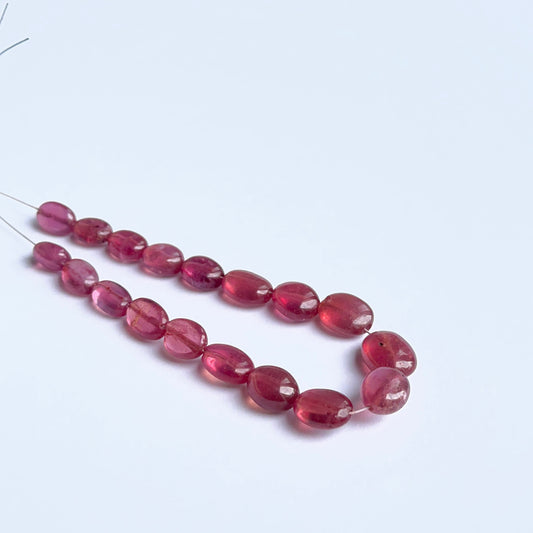 Ruby stone beads in smooth oval cut, 18 pieces with vibrant red tones for jewellery making.