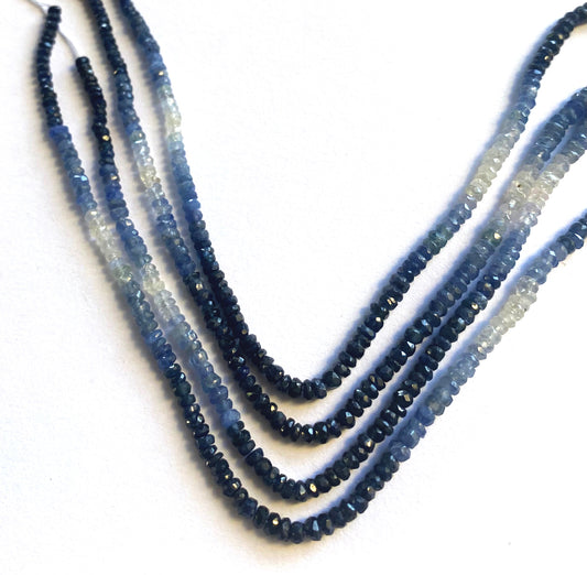 Close-up of 2.8-3.5mm faceted Blue Sapphire beads showing rich shading and precision cut.