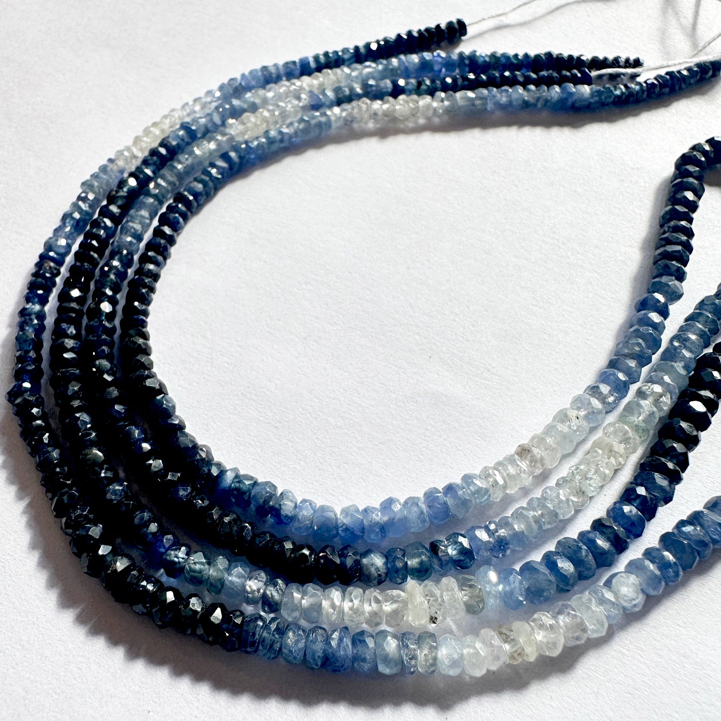 Blue sapphire rondelles in 2.9–3.9mm sizing, strung across 40cm for design versatility.