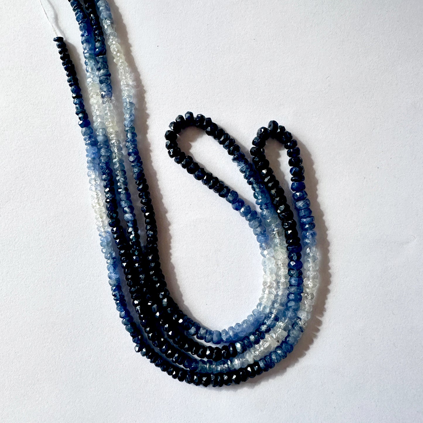 Premium faceted blue sapphires with a subtle colour fade and sparkling finish