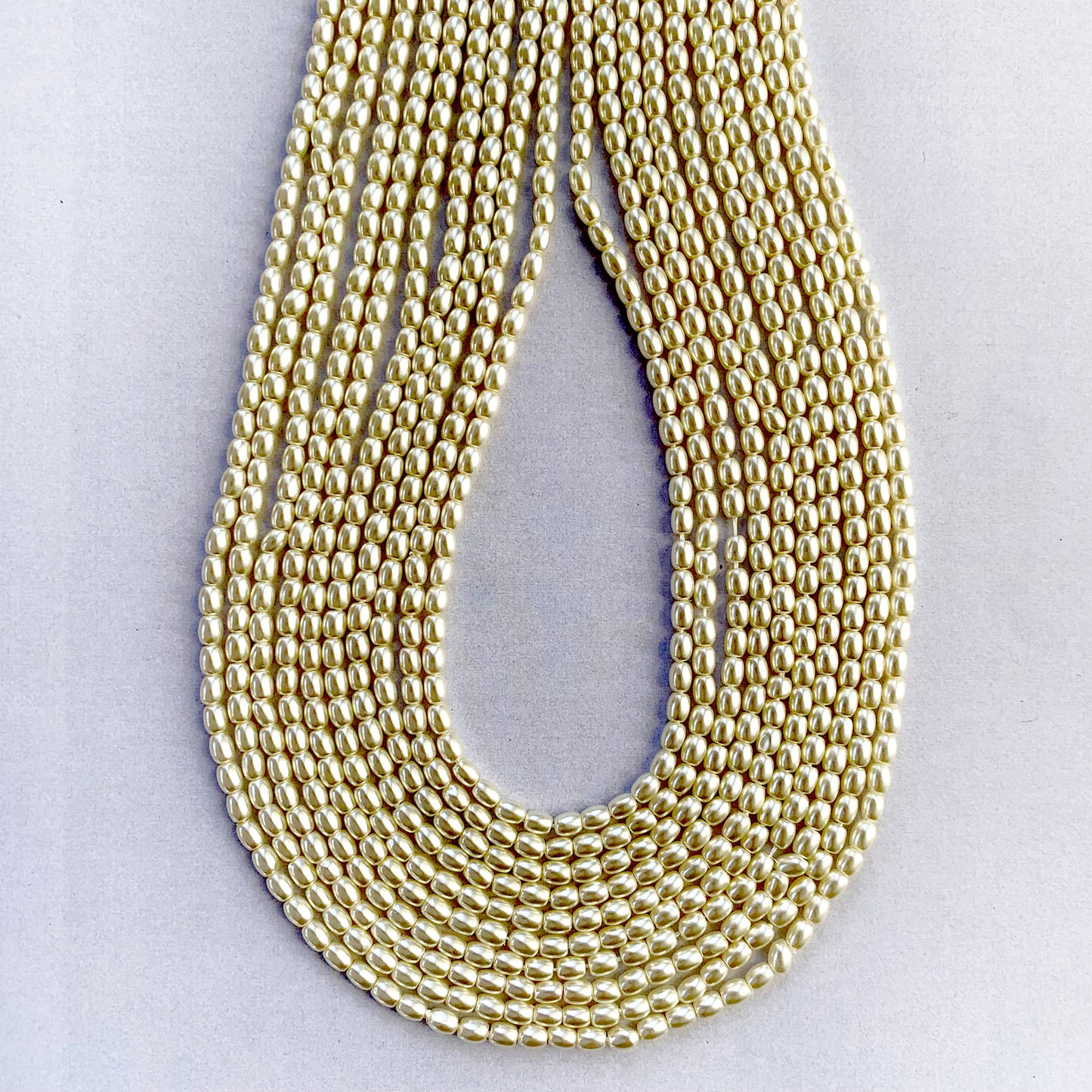 Macro photo highlighting the elegant white tone and oval silhouette of shell pearls.