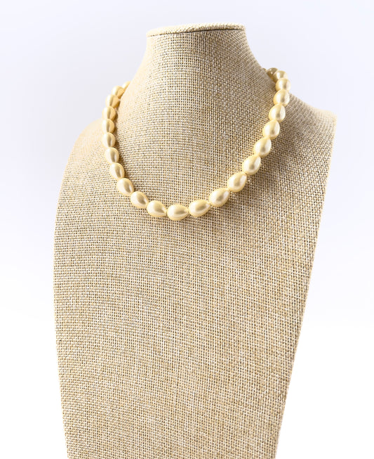 Genuine Shell Pearl oval beads in smooth polished finish, ideal for classic jewellery designs and DIY necklace making.