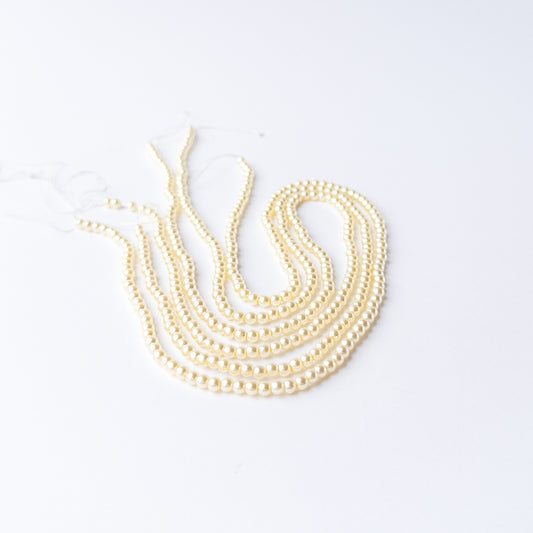 Genuine Shell Pearl gemstone beads showcasing polished finish and uniform round shape.