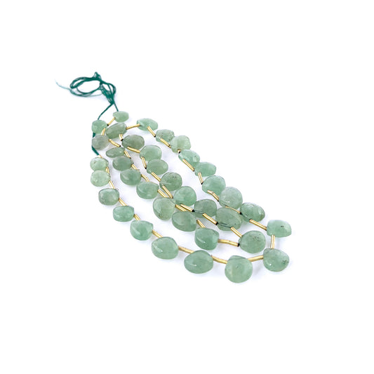 Strawberry Quartz faceted briolette gemstones with glossy green surfaces, crisp teardrop faceting, and green colour throughout a long 50cm strand.