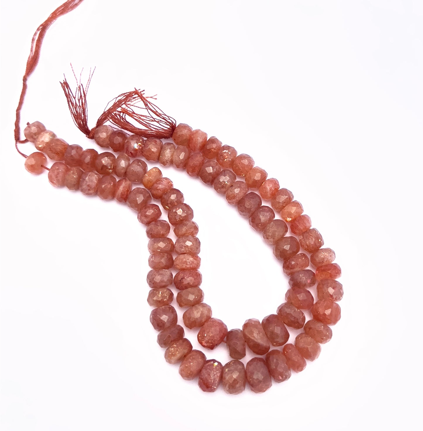 Handmade jewellery components featuring Sunstone faceted rondelle beads in glowing tones.