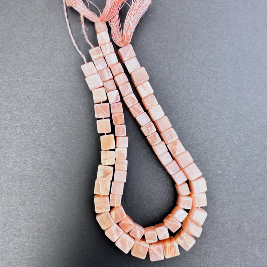 Natural gemstone beads in Sunstone, arranged on a 20cm strand with consistent square cut.