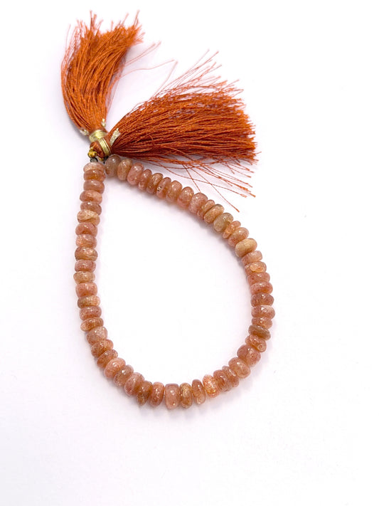 Polished stone beads arranged on a 20cm strand for handmade jewellery components.