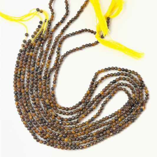 Tiger Eye micro faceted rondelle beads displayed on a 32cm strand to highlight their shimmer and colour depth.