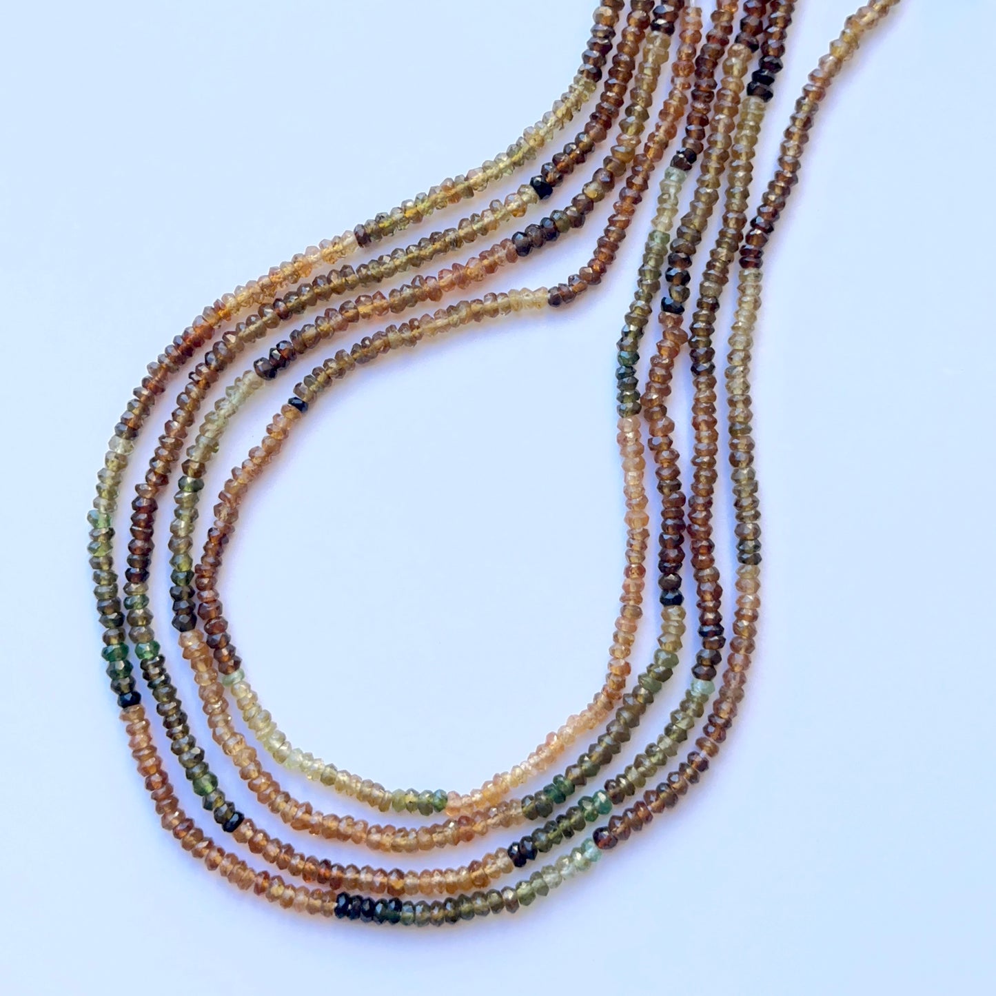 Close-up of Tourmaline 3–3.5mm faceted rondelle beads highlighting crisp facets and vivid colour for handmade jewellery components.