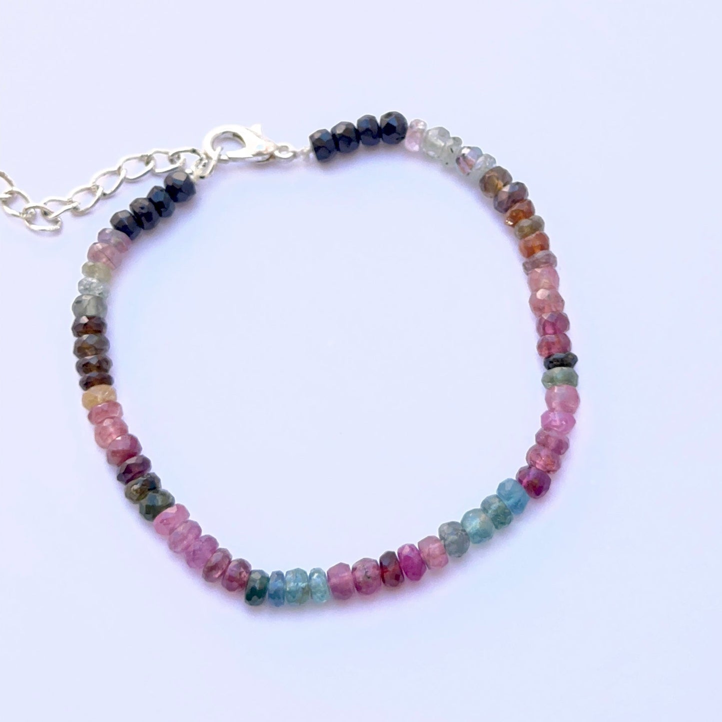 Elegant gemstone bracelet featuring faceted tourmaline beads in a refined layout.