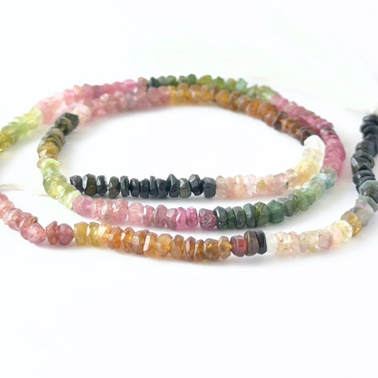 Close view of Watermelon Tourmaline faceted rondelle beads showing cut, clarity and vibrant colour variation.