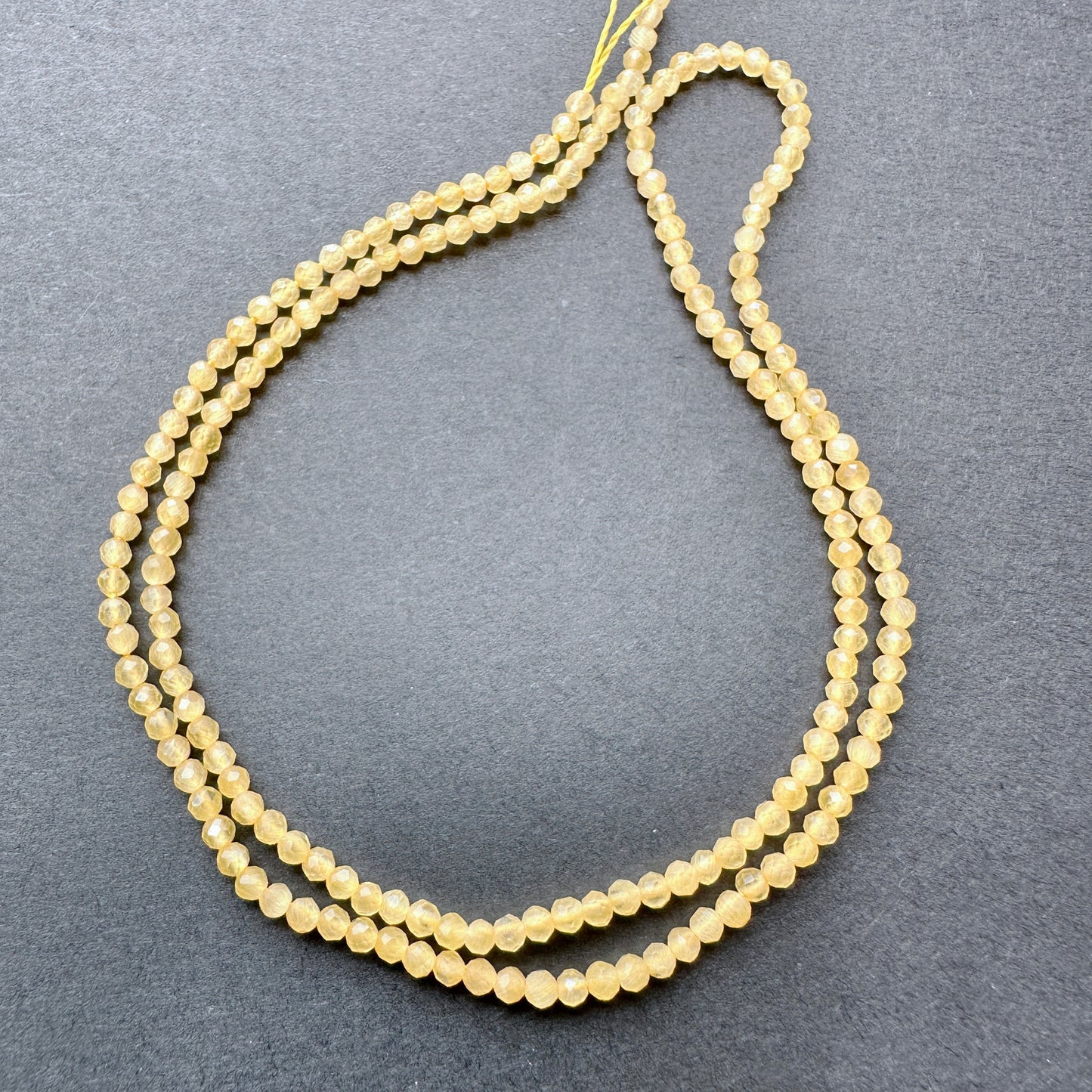 Stone Beads in Yellow Chalcedony with refined faceted rondelle cut for elegant handmade jewellery.