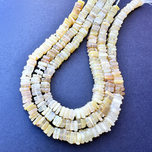 Smooth yellow opal stone beads for DIY jewellery projects, showcasing vibrant colour and handmade jewellery components.
