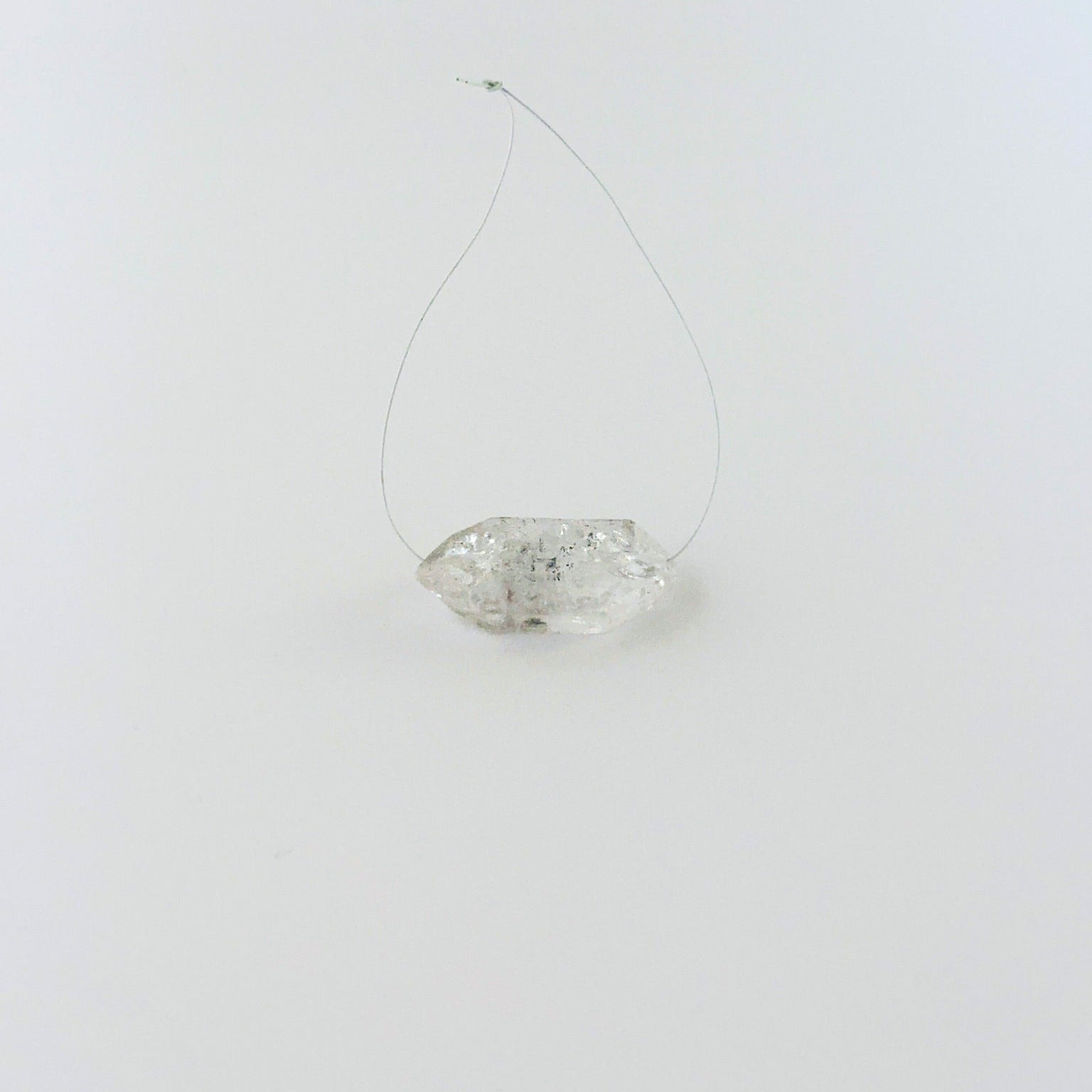 Rough Herkimer Diamond bead arranged for display, highlighting its raw surface and handmade jewellery component quality