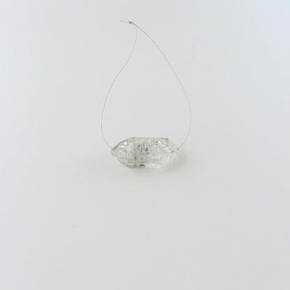 Rough Herkimer Diamond bead arranged for display, highlighting its raw surface and handmade jewellery component quality