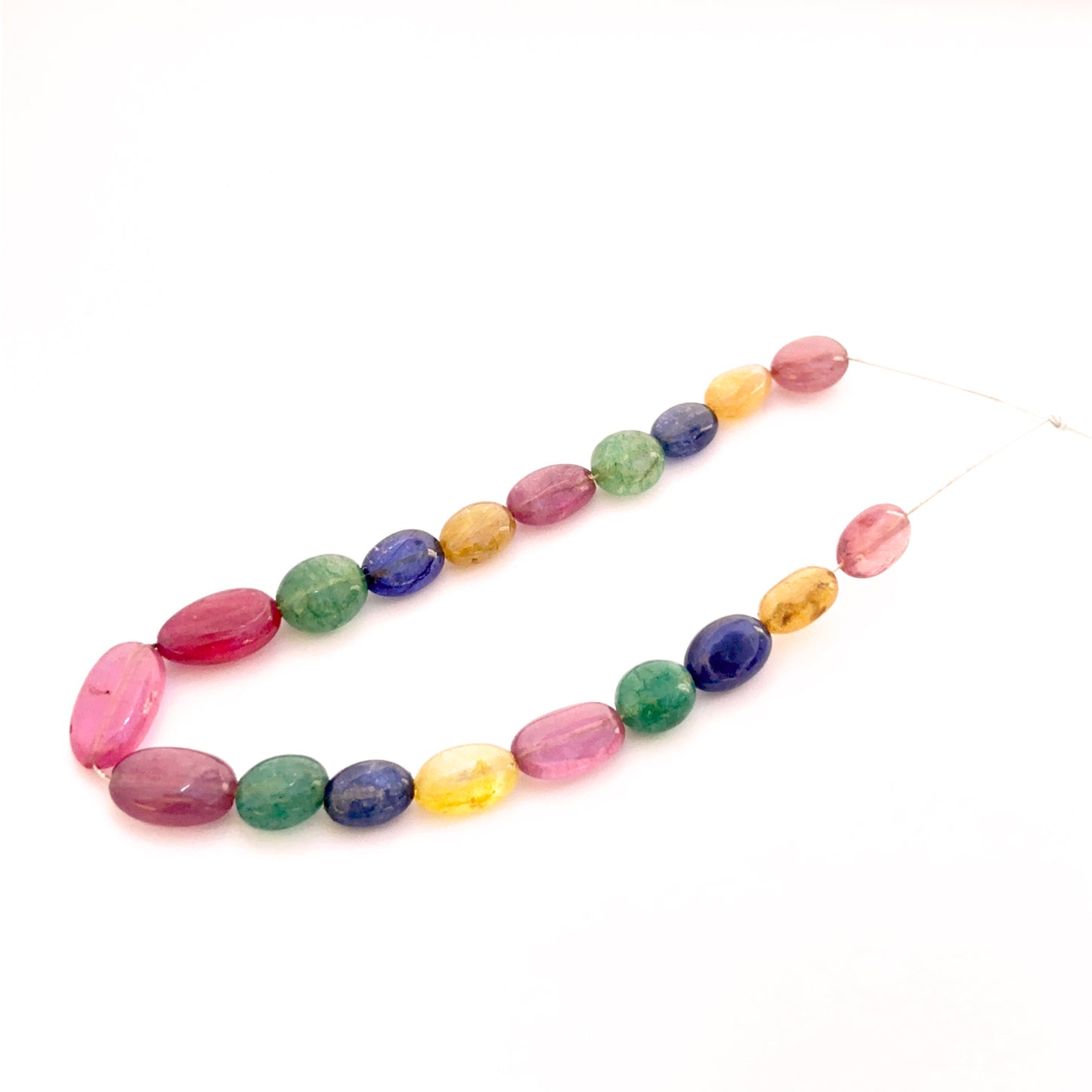 Multi precious smooth oval beads 7x5mm–13x7mm featuring yellow sapphire, blue sapphire, ruby and emerald, 19 pieces, 45 carat.