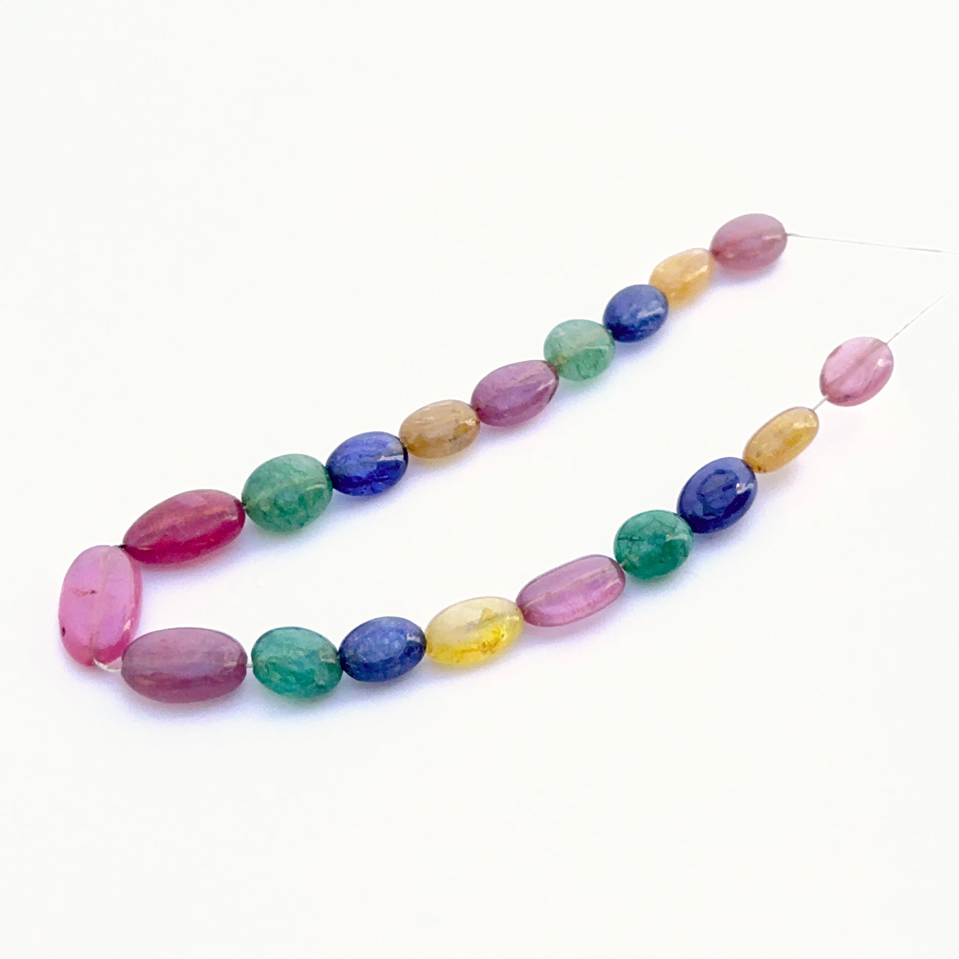 Gemstone beads smooth oval 7x5mm–13x7mm with yellow sapphire, blue sapphire, ruby and emerald for artisan designs.
