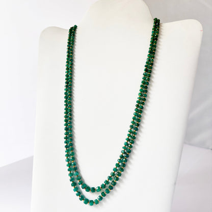 Necklace with delicate strands of Beryl Emerald beads, showcasing their smooth design.