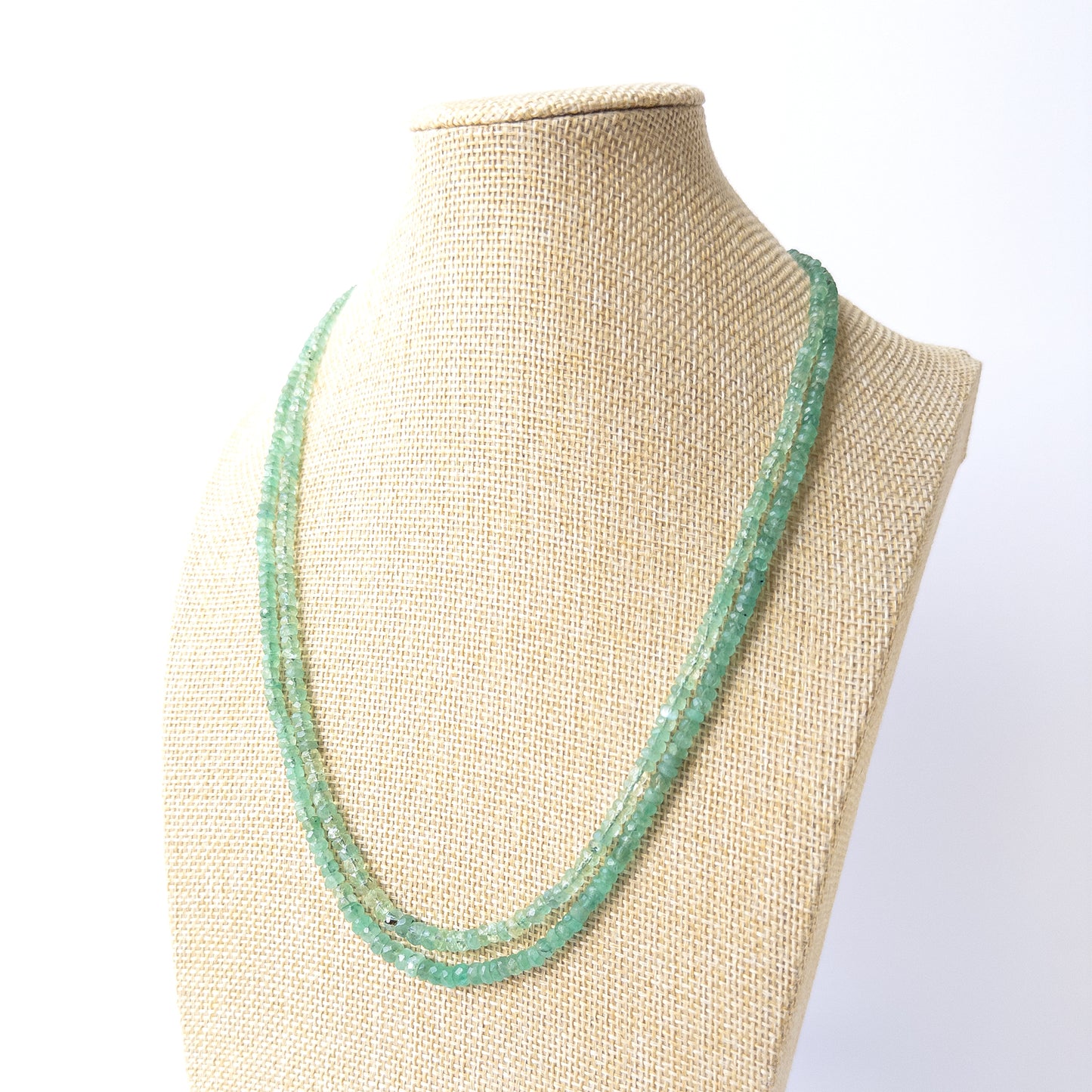 Genuine Beryl gemstone beads in faceted rondelle cut showing soft shimmer and clarity for DIY jewellery projects.