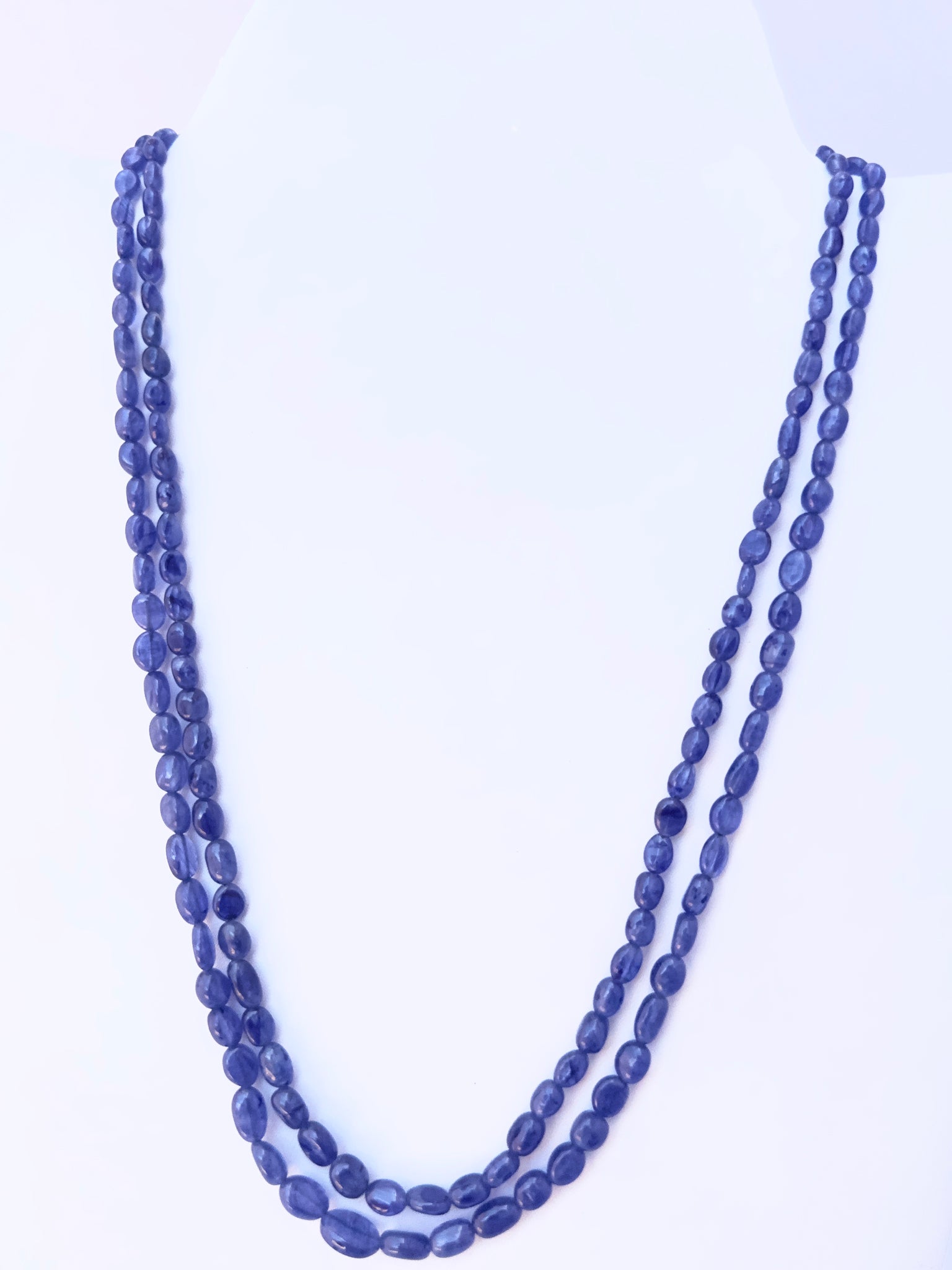 Blue Sapphire necklace with smooth oval beads, two strands, 4.3–6.5mm size, radiant deep blue.