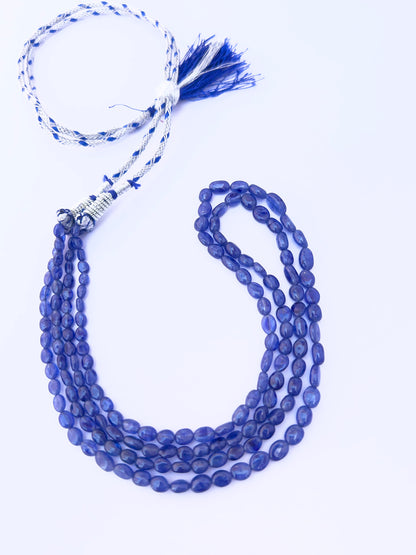 Blue Sapphire gemstone beads necklace, polished oval cut, radiant shine, silk tassel detail.